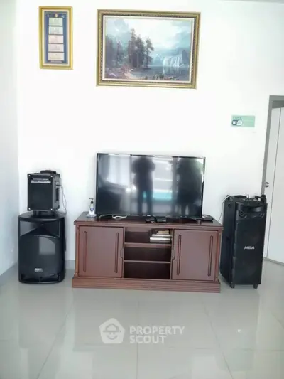 Modern living room with sleek TV setup and elegant decor