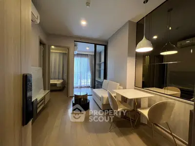 Modern living room with elegant dining area and cozy bedroom view