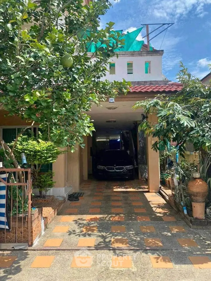 Charming suburban home with lush garden and driveway, perfect for family living.