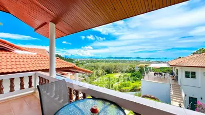 Stunning balcony view with expansive landscape and ocean horizon