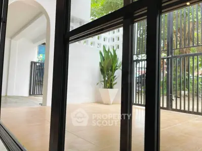 Modern patio with sleek glass doors and stylish potted plant