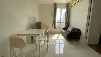 Bright minimalist living room with modern furniture and city view.