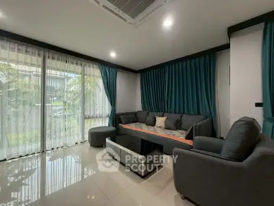 Modern living room with large windows and stylish furniture