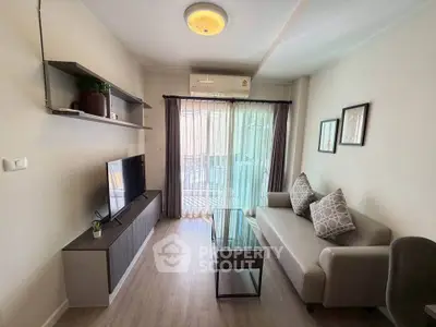 Modern living room with sleek furniture and natural light, perfect for cozy relaxation.