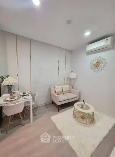 Chic and cozy living room with modern decor and dining area, perfect for urban living.