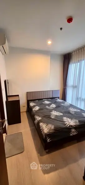 Modern bedroom with stylish decor and natural light