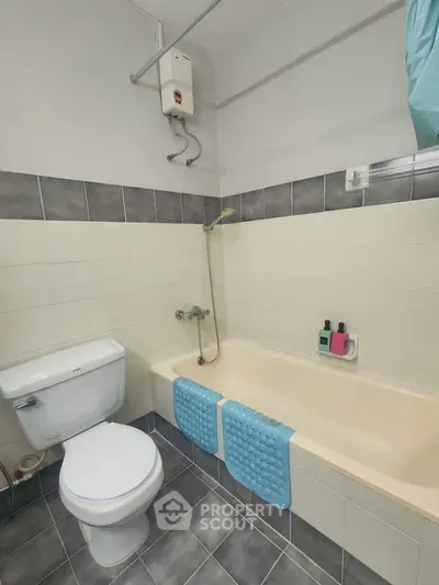 Cozy bathroom with bathtub and modern fixtures in a stylish apartment.