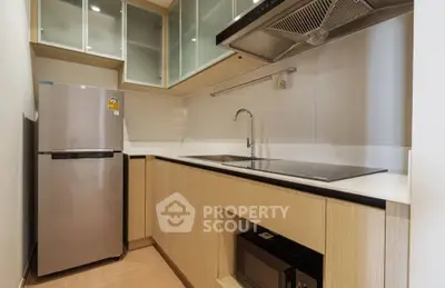 Modern kitchen with sleek appliances and ample storage space