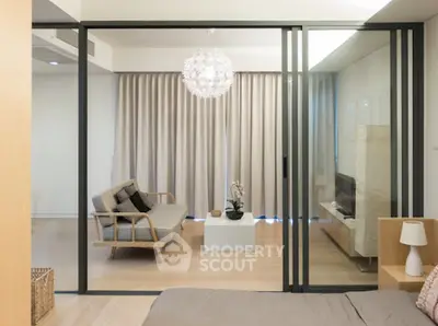 Modern living room with sliding glass doors and stylish furniture