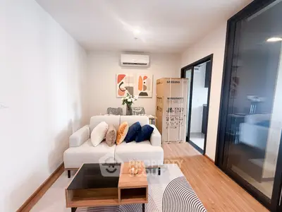 Modern living room with stylish decor and air conditioning in a cozy apartment.