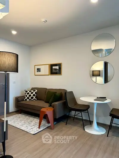 Modern living room with stylish decor, cozy sofa, and elegant lighting in a contemporary apartment.