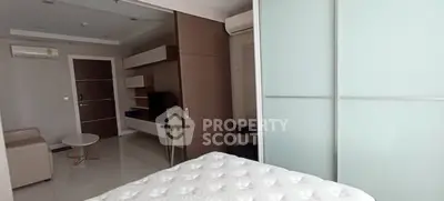 Modern studio apartment with sleek furniture and air conditioning