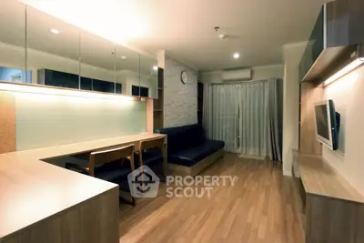 Modern living room with wooden flooring and stylish furniture