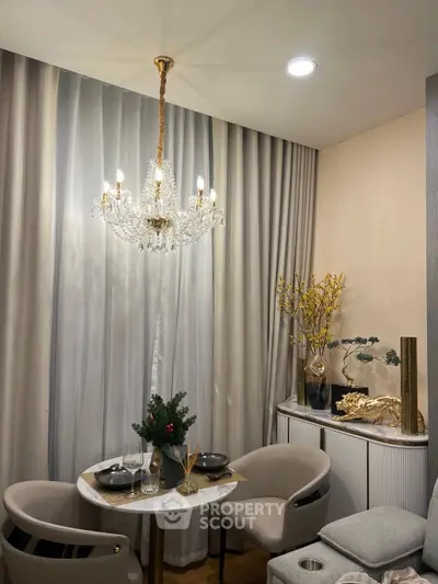 Elegant dining nook with chandelier and stylish decor, perfect for intimate gatherings.