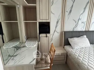 Modern bedroom with stylish marble accents and cozy furnishings