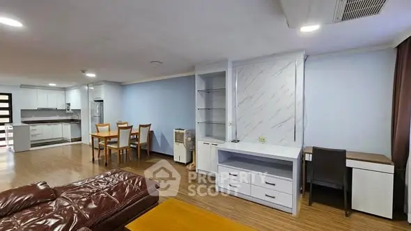 Spacious open-plan living room with modern kitchen and dining area