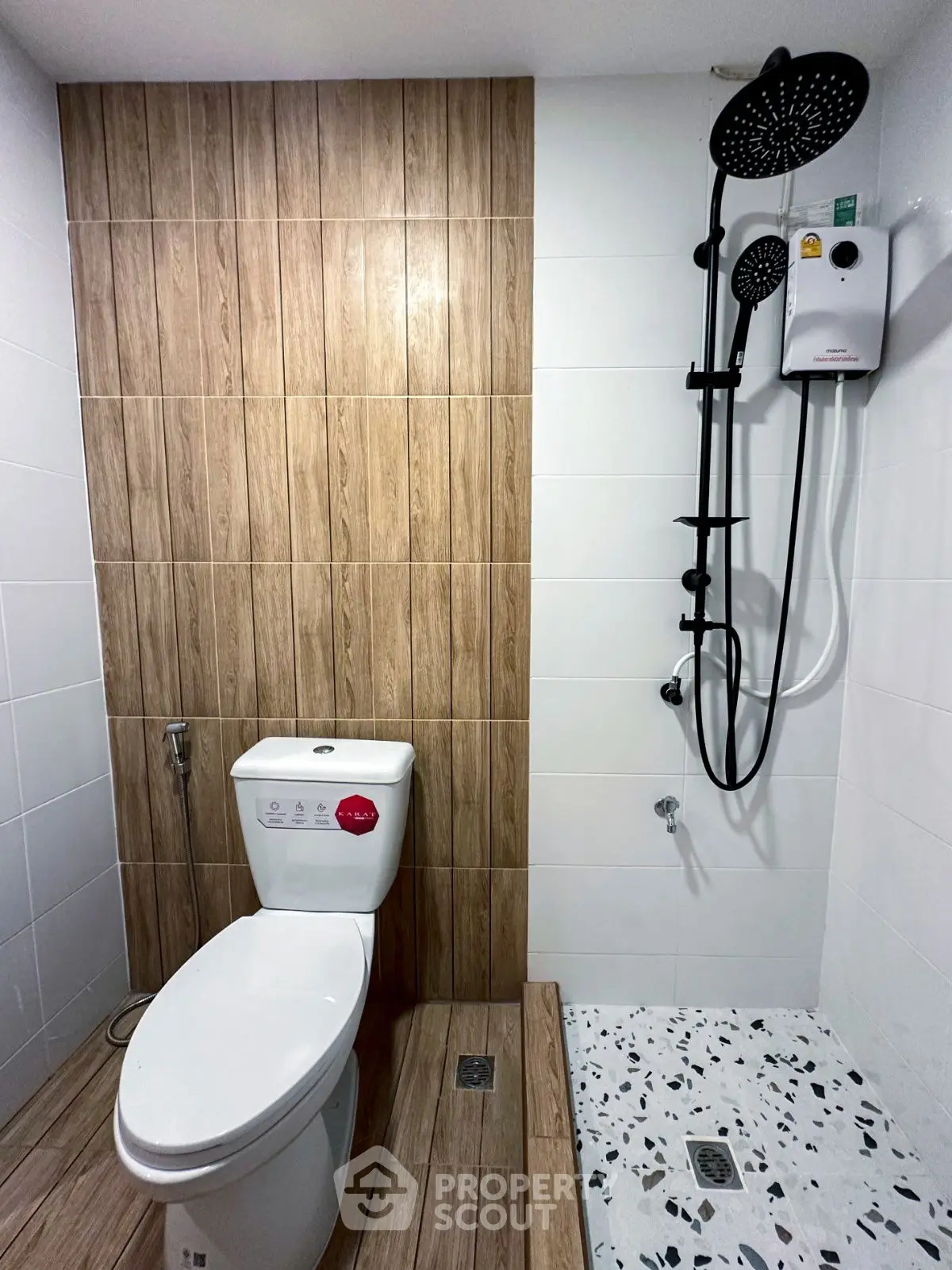 Modern bathroom with stylish shower and wooden accent wall