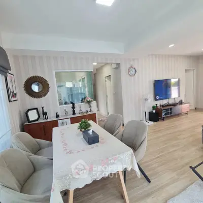 Spacious living room with elegant decor and modern furniture, perfect for family gatherings.