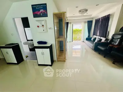 Spacious living room with modern decor and large windows for natural light.