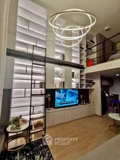 Modern living room with high ceilings, elegant lighting, and stylish shelving in a loft apartment.