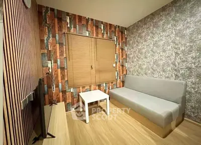 Modern living room with stylish wood paneling and cozy sofa