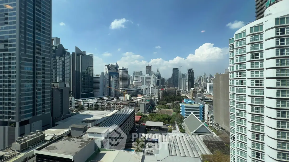 Stunning cityscape view showcasing modern skyscrapers and urban architecture under a clear blue sky.