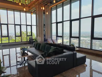Luxurious living room with panoramic city views and elegant decor
