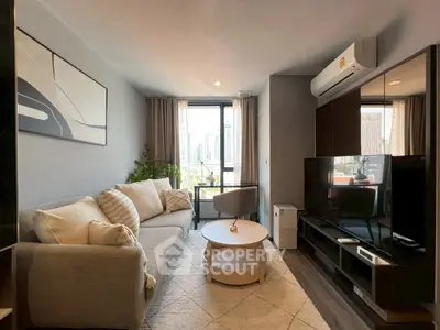 Modern living room with city view, stylish decor, and natural light