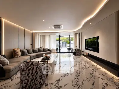 Luxurious modern living room with marble flooring and stylish furniture, featuring a large TV and floor-to-ceiling windows.