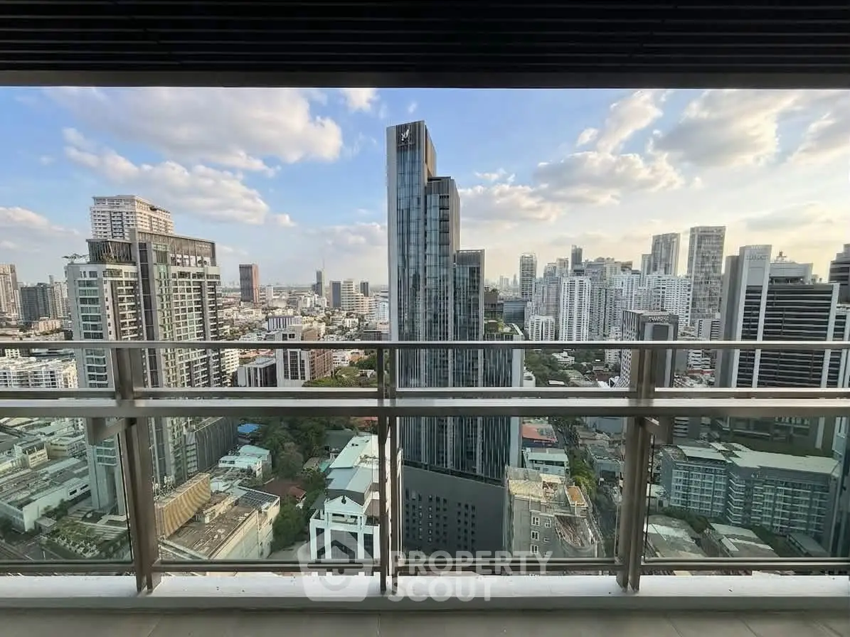 Stunning cityscape view from a high-rise balcony showcasing modern urban skyline.