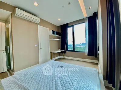 Modern bedroom with large window and city view, featuring air conditioning and minimalist decor.
