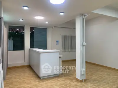 Spacious modern interior with sleek lighting and wooden flooring