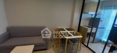 Modern apartment interior with cozy living area and compact kitchen