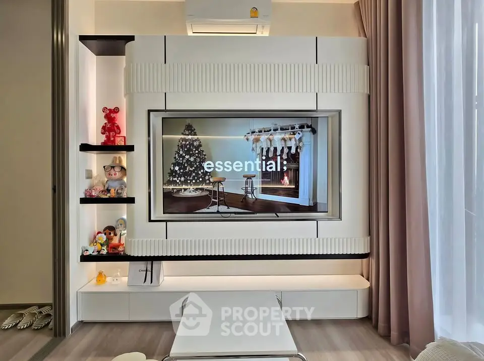 Modern living room with stylish TV unit and decorative shelves