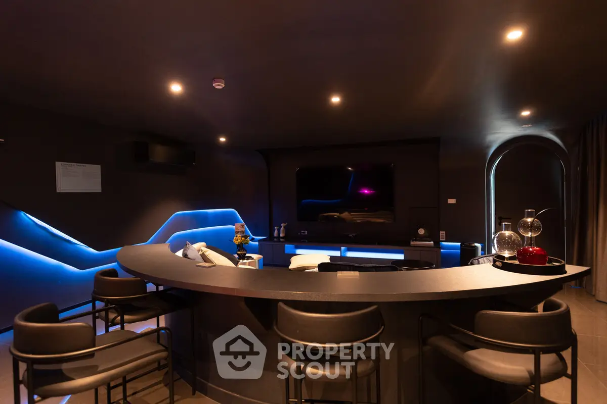 Luxurious modern living room with ambient lighting and sleek bar area, perfect for entertaining.