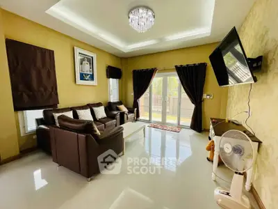 Elegant living room with modern decor, large windows, and stylish furniture in a cozy home setting.