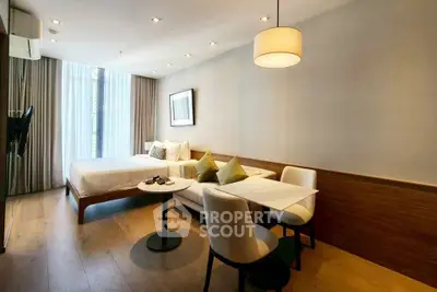 Modern studio apartment with cozy living area and stylish decor