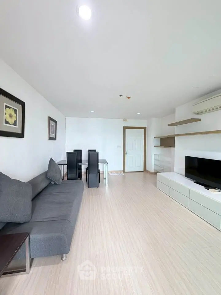 Spacious modern living room with sleek furniture and natural light