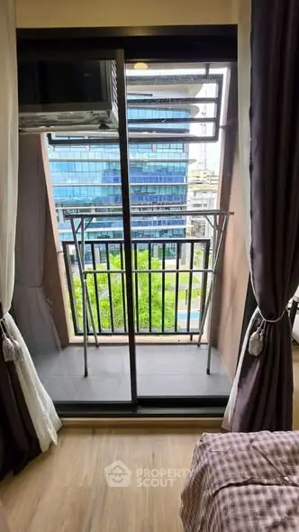 Charming small balcony with city view, perfect for urban living.