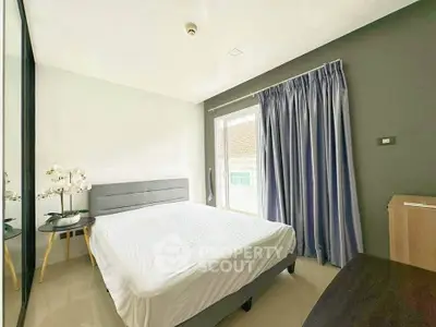 Modern bedroom with large window and elegant decor