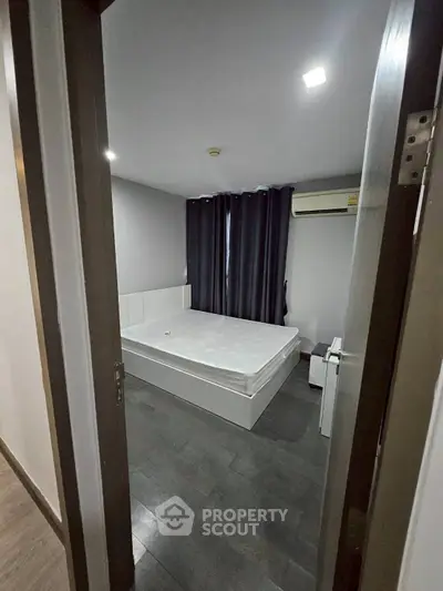 Modern bedroom with minimalist design and air conditioning