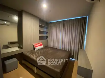 Modern bedroom with stylish decor and ample natural light