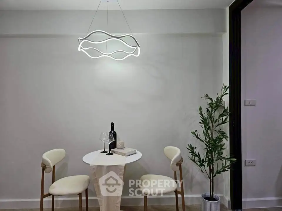 Modern dining nook with stylish lighting and minimalist decor