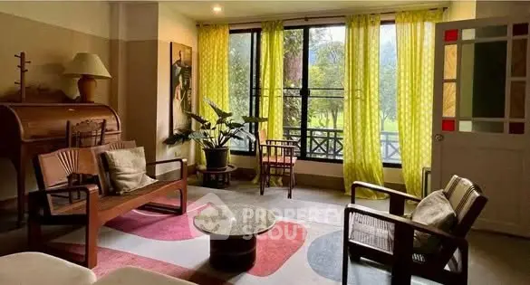 Charming living room with vintage decor, large window, and garden view, perfect for relaxation and entertaining.