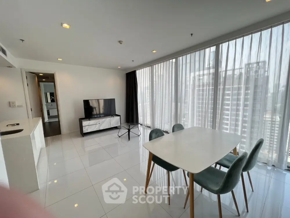 Modern living room with sleek furniture and city view, perfect for urban lifestyle seekers.