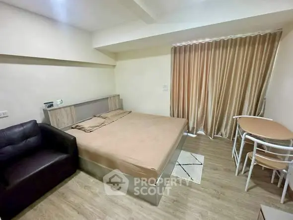 Cozy bedroom with modern furnishings and natural light