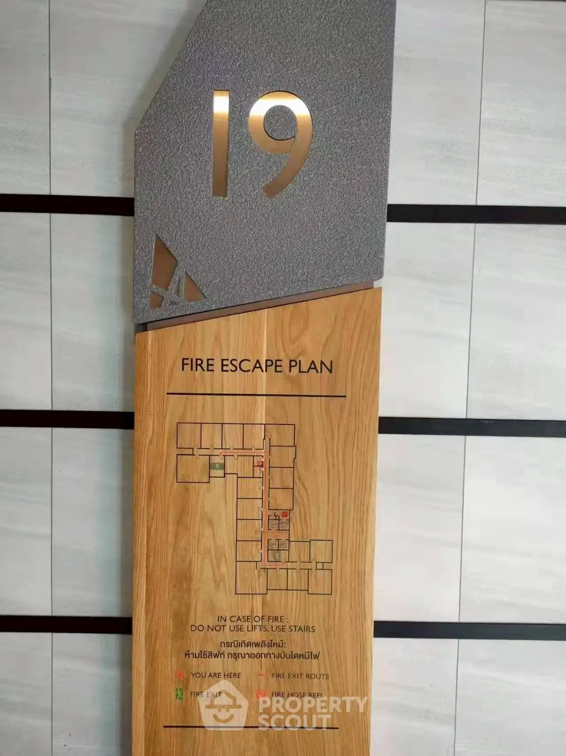 Modern fire escape plan sign on building floor 19, stylish design.