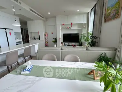 Spacious modern living room with open kitchen and elegant decor