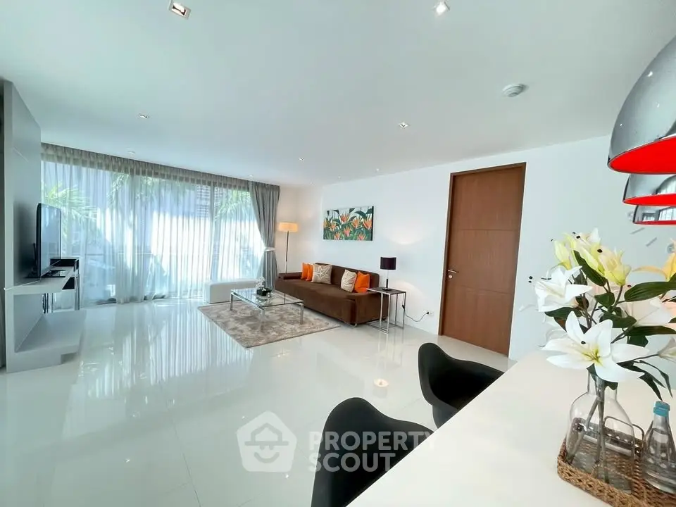 Spacious modern living room with sleek design and abundant natural light