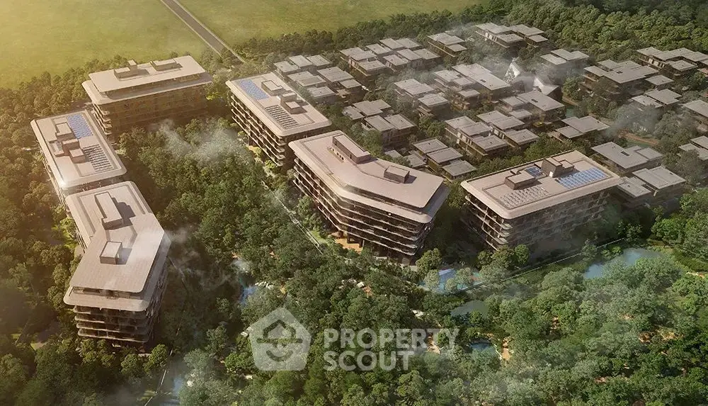 Aerial view of modern residential complex surrounded by lush greenery and scenic landscape.